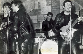 The Beatles, at the Cavern Club, with their former drummer Pete Best
